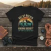 Black t-shirt with "Out of Breath Hiking Society Don't Worry I'll Be There In A Minute" text and vintage mountain