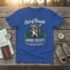 T-shirt with "Out of Breath Hiking Society Be There In A Minute" text and a raccoon hiking graphic