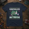 Overstimulated But Festive Opossum Christmas T-Shirt design with a possum entangled in fairy lights and snowflakes