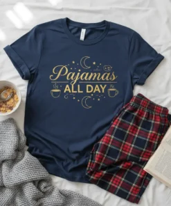 Navy blue t-shirt with gold text "Pajamas All Day" and celestial graphics, part of a cozy pajama set