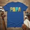 Blue PAPA Golf T-Shirt with gold and teal golfer graphics, featuring the word PAPA