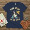 Papa Goose On The Loose t-shirt design featuring a goose riding a scooter with balloons, text in yellow and gold