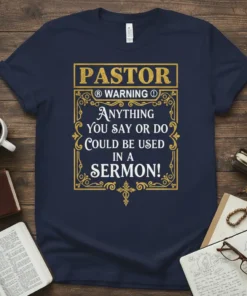 Navy t-shirt with "Pastor Warning Anything You Say or Do Could Be Used in a Sermon!" quote in gold decorative