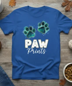 Blue t-shirt with "PAW Prints" text and two green paw print graphics, designed for dog lovers