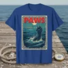 PAWS T-Shirt featuring a bear paw rising from ocean waves, with a swimmer in the background and vintage movie poster