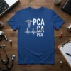 Blue t-shirt with "PCA CA PCA" text, Caduceus symbol, and heartbeat EKG graphic