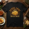 Peace Love Grilled Cheese T-Shirt featuring a toasted sandwich graphic and warm typography