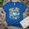 Peace Love Mermaids text design with a peace symbol, heart, and a stylized mermaid tail on a royal blue t-shirt