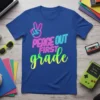 Blue t-shirt with neon "Peace Out First Grade" text and peace sign graphic
