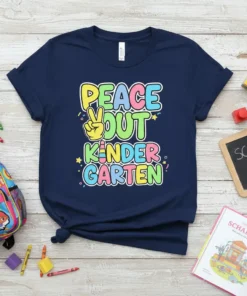 Peace Out Kindergarten text design with peace sign graphic on a navy blue t-shirt, bright colors, and confetti accents