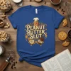 Peanut Butter Slut funny food quote on a blue t-shirt, featuring a winking peanut character holding jars of peanut butter