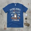 Penguins Can't Fly I Can't Fly Therefore I Am A Penguin text design on a blue t-shirt featuring a cute
