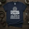 Navy t-shirt with white text "Personal Stalker I Will Follow You Whenever You Go Bathroom Included" and German Shepherd graphic