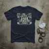 Navy t-shirt with "PG COUNTY JAIL INMATE #001" text, prison bars, and handcuffs graphic
