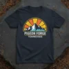 Pigeon Forge Tennessee text with mountain sunset graphic on a dark t-shirt
