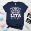 Navy t-shirt with "PINK OR BLUE LITA Loves you" text and rainbow graphic, gender reveal theme