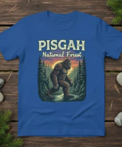 Pisgah National Forest t-shirt design featuring Bigfoot walking through a forest at sunset