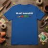Blue t-shirt with white "Plant Manager" text and cartoon carrot, tomato, cabbage, and radish graphics