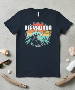 Retro Playalinda Beach t-shirt design featuring a large ocean wave, palm trees, and a colorful sunset background