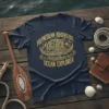 Polynesian Adventure Ocean Explorer text and graphic design on a navy blue t-shirt, featuring a traditional canoe and tribal patterns