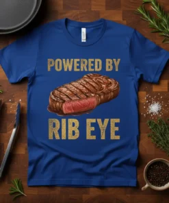Royal blue t-shirt with gold text "POWERED BY RIB EYE" and a realistic image of a grilled rib eye steak
