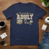 Practically an ADULT quote t-shirt with cartoon illustrations of stacked items, a plant, and coffee