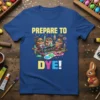 PREPARE TO DYE! text with cartoon characters dyeing Easter eggs, set against a blue t-shirt