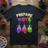 Prepare To Dye t-shirt design featuring colorful dripping letters and laboratory beakers filled with vibrant dyes