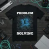 Black t-shirt with white text "PROBLEM SOLVING" and a blue glowing circuit board graphic of a person solving equations