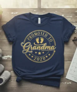 Promoted to Grandma 2020 text with baby footprints graphic on a navy t-shirt