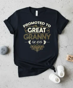 Promoted to Great Granny Est. 2025 text design with baby footprints and floral accent on a black t-shirt