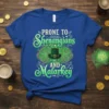 Prone To Shenanigans And Malarkey quote with shamrocks and a green top hat on a blue t-shirt