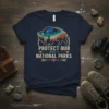 Bison silhouette graphic with "Protect Our National Parks" text and tribal arrows on a navy blue t-shirt