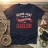 Proud Aunt of a Freaking Awesome Sailor text design with red ribbon and stars on a navy blue t-shirt