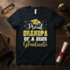 Proud Grandpa Of A 2025 Graduate text with graduation cap and stars on a black t-shirt