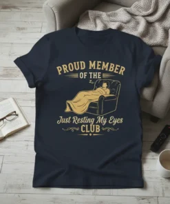 Proud Member of the Just Resting My Eyes Club t-shirt design with a person sleeping in a recliner