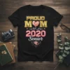 Proud Mom of a 2020 Senior t-shirt with gold, pink, and silver typography and graduation cap graphic