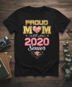 Proud Mom of a 2020 Senior t-shirt with gold, pink, and silver typography and graduation cap graphic
