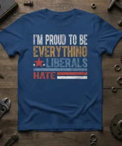 T-shirt with white and orange text reading "I'm Proud To Be Everything Liberals Hate" with patriotic stars and stripes graphic