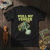 Black t-shirt with "PULL MY FINGER" text and a robotic hand releasing a puff of smoke