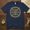 Navy t-shirt with gold "Pulling Out-Never Works" text inside a compass rose and rope circle graphic