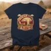 Queen of the Camper graphic t-shirt featuring a vintage RV, campfire, and camping chair