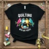 Quilting Wth My Peeps T-Shirt featuring four colorful birds on a branch with sewing supplies, white text, and dashed circle