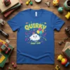 Quirky Zany Fun text with a smiling cloud character holding balloons on a blue t-shirt, surrounded by confetti