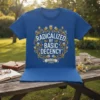 Blue t-shirt with "Radicalized By Basic Decency" text in a circular floral design, "Esteemed" banner below
