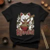 Cute ramen cat eating noodles with chopsticks, featuring the word RAMEN in Japanese-inspired font on a black t-shirt