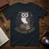 Read More Books owl design on a black t-shirt, featuring a cute owl sitting on books with stars and hearts