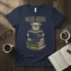 Bulldog wearing glasses reading a book on a stack of books, text "READ MORE BELIEVE IN YOURSELF S READ MORE"