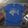 Blue t-shirt with the text "REAL GIRLS FISH" above an ornate, colorful fish skeleton graphic