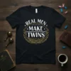 Real Men Make Twins quote on a black t-shirt with gold and white vintage-inspired design elements and wings